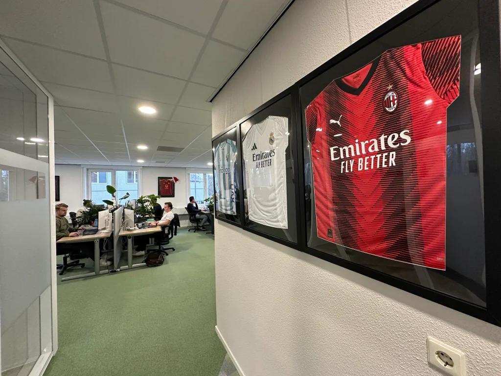 Shirts of partner clubs on display in the XS2Event office