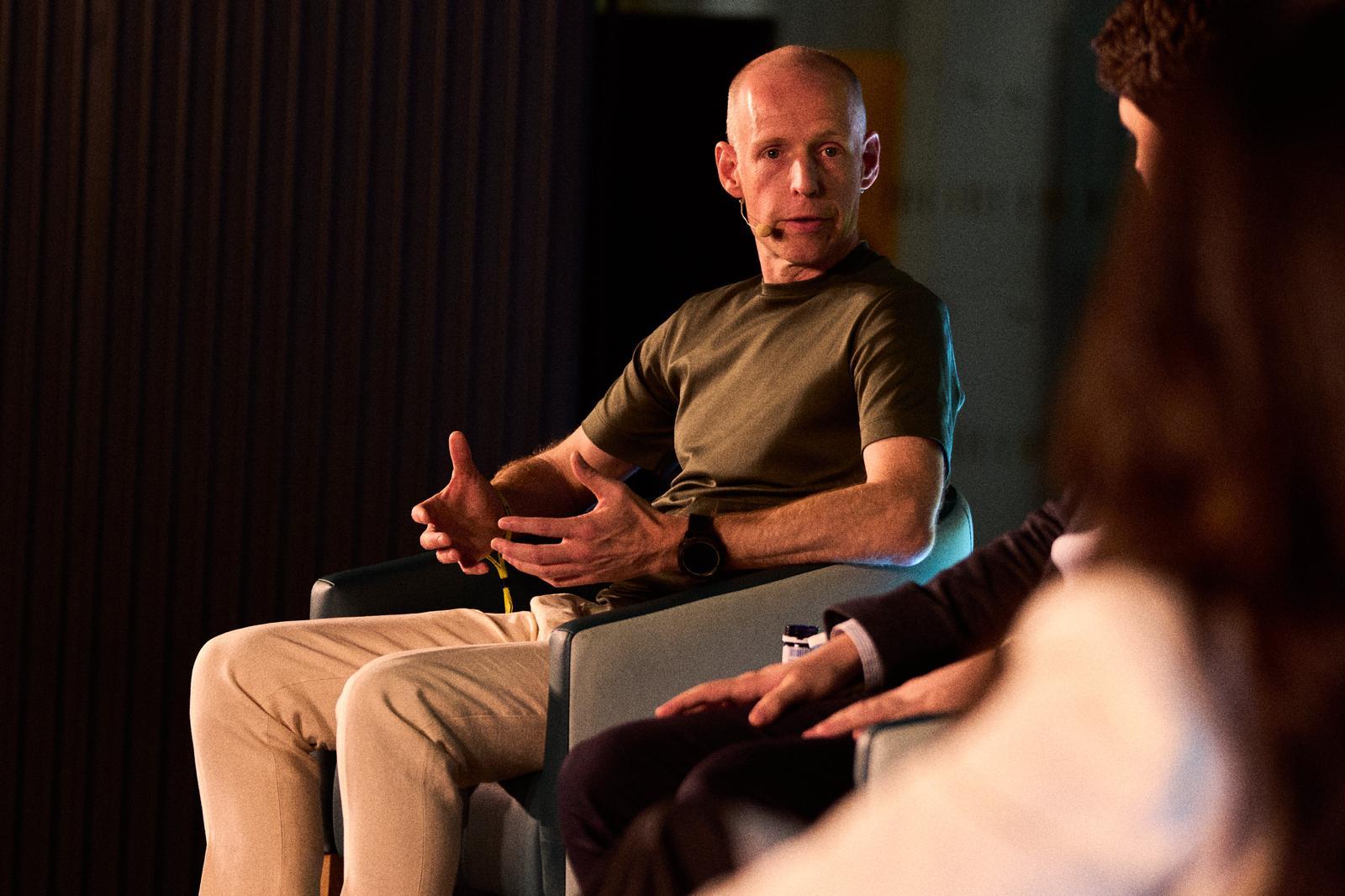 A XS2Event co-founder speaking on stage at a trade show